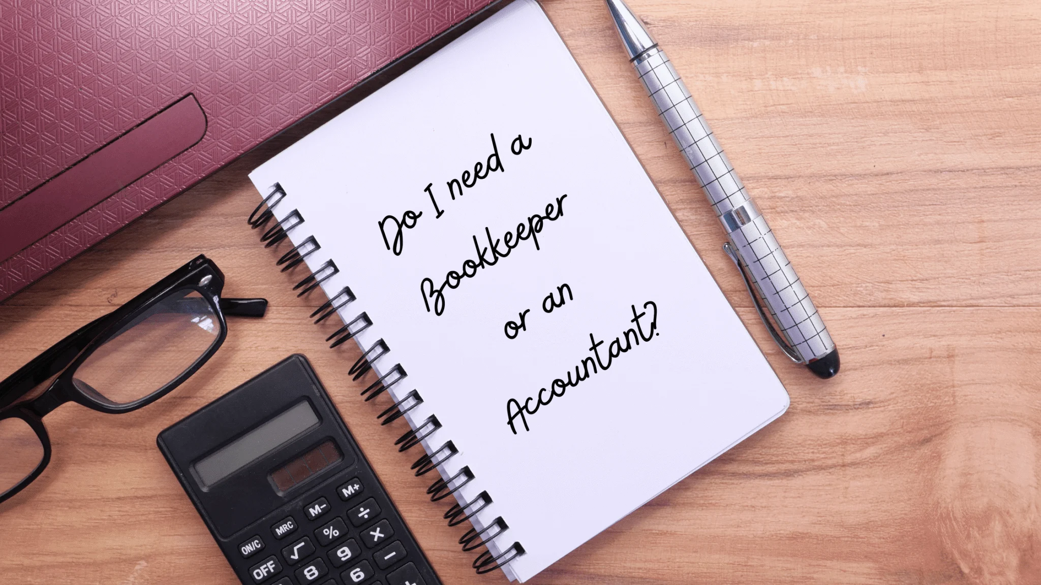 do-I-need-a-bookkeeper-or-an-accountant-header-written-on-a-pad