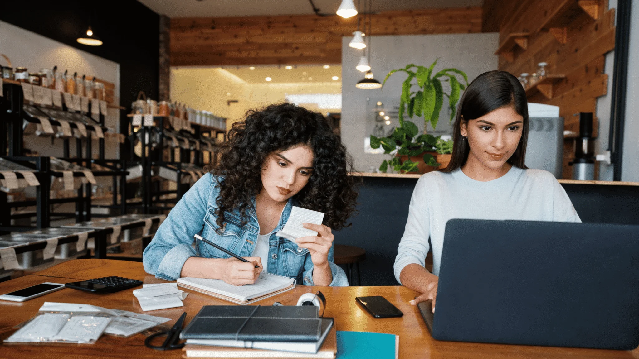 women-doing-admin-and-bookkeeping-on-laptop-and-pad women-doing-admin-and-bookkeeping-on-laptop-and-pad